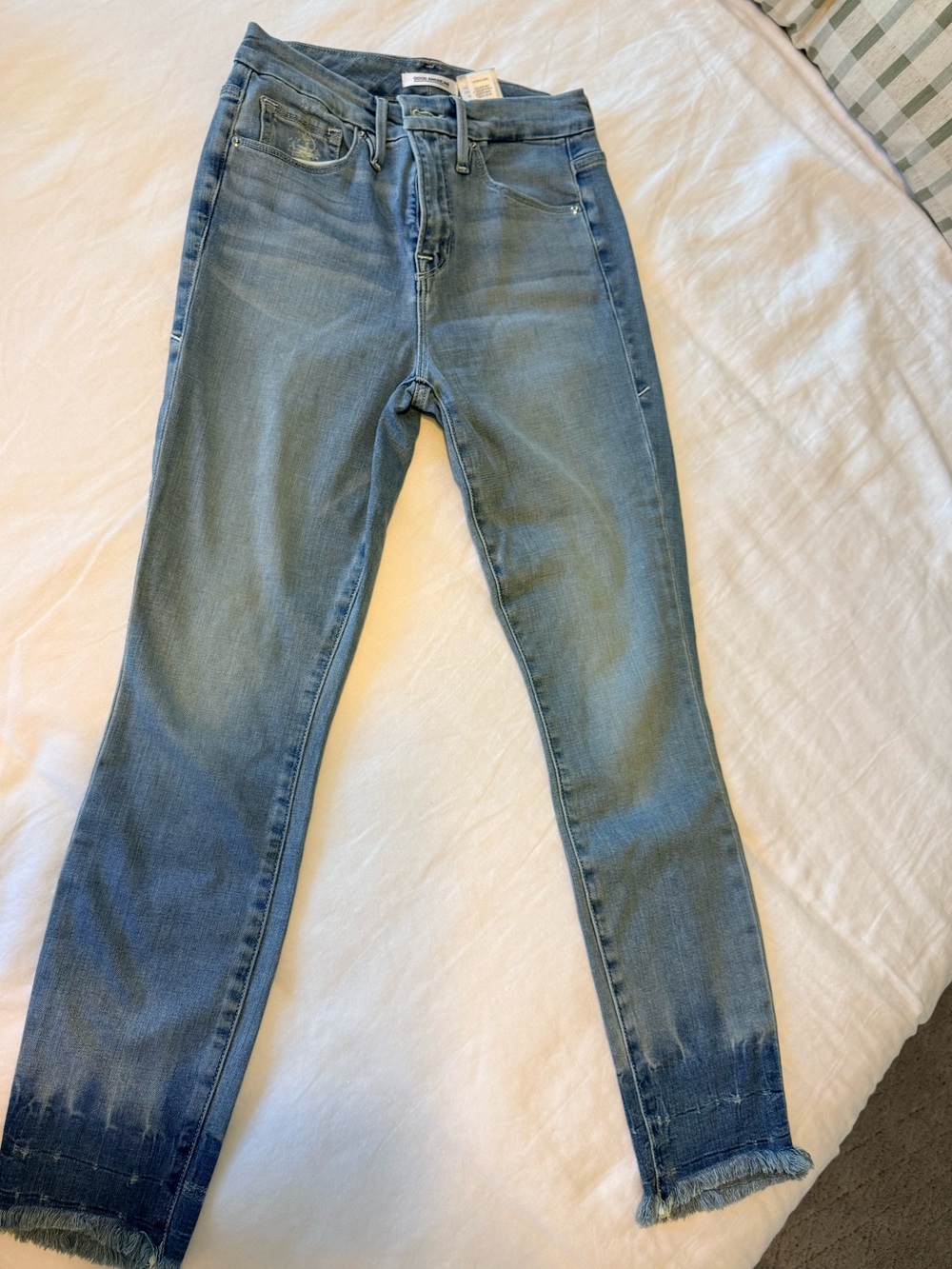 Good American Light Blue Skinny Jeans with Frayed Hem Detail